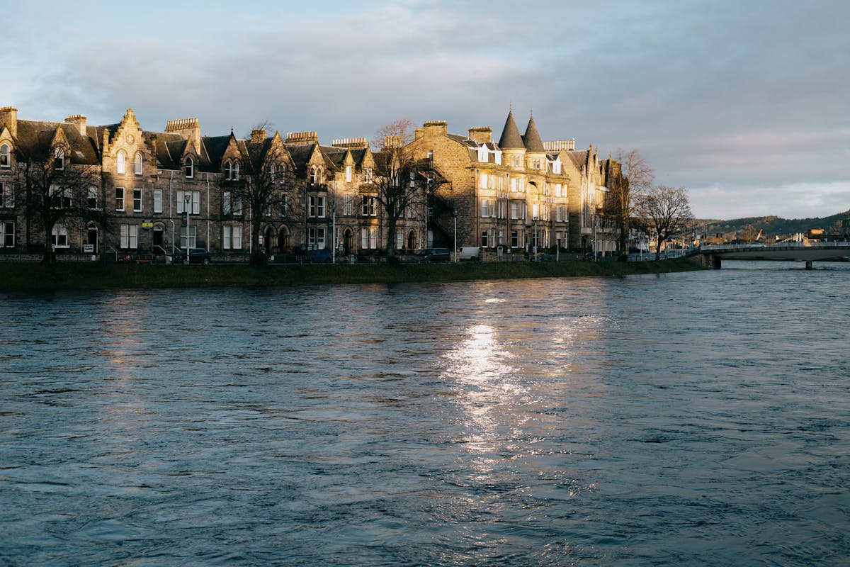 The River Ness flowing through Inverness city centre with Inverness Castle on the hill